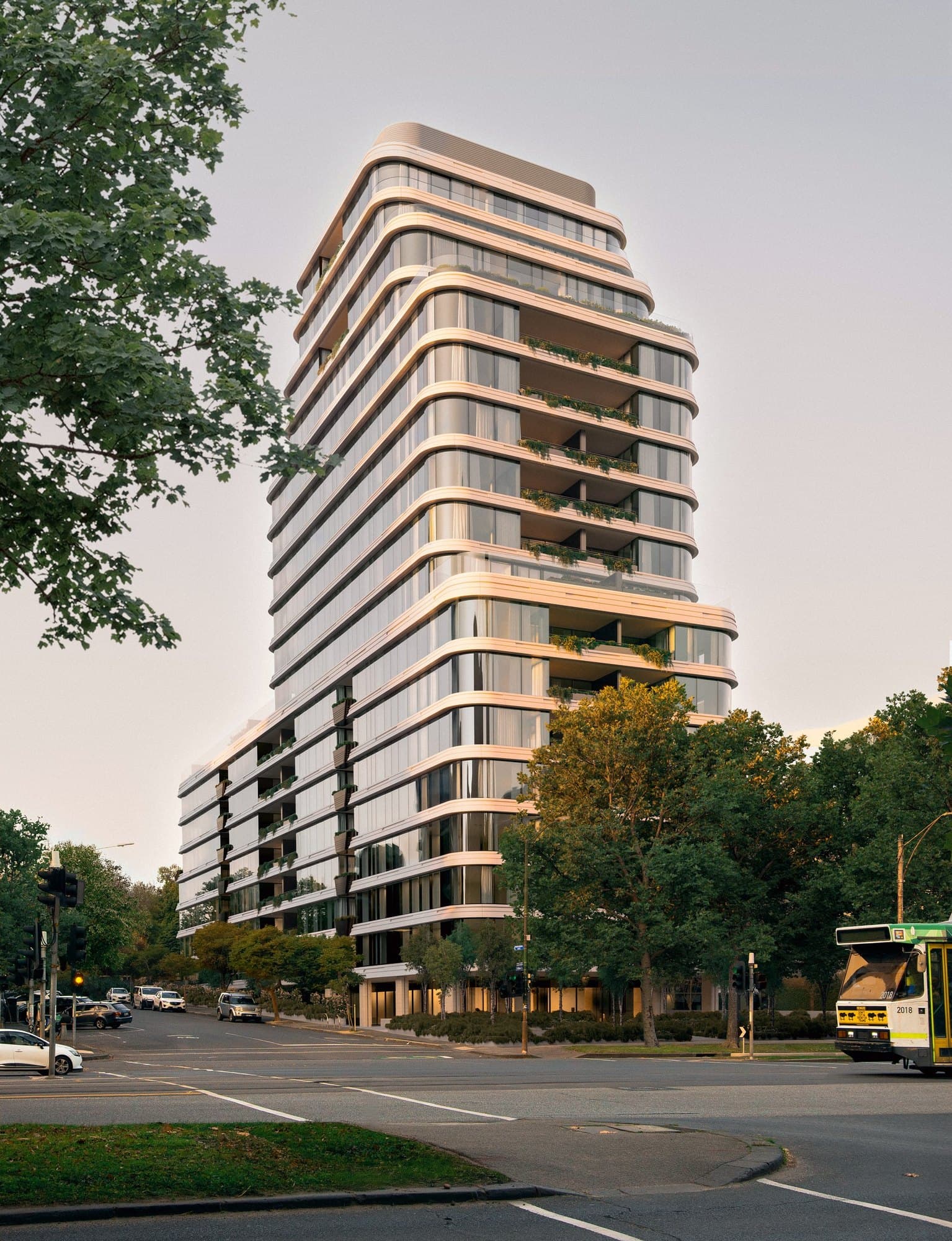 Curved glass tower with planted balconies at 437 St Kilda Road
